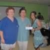 Dr.Isis johnson-Brown, Pat Chan (director, and founder of Spay Panama), and Piera LoMedico (SPAYes volunteer) receiving a check from a Savannah, Georgia USA fundraiser.